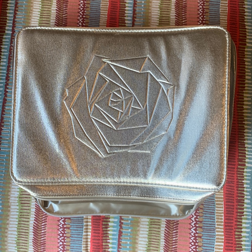 Gold Lancôme makeup bag